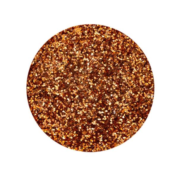 Nahaufnahme von feinem Bio-Glitter in einem warmen, metallischen Kupferton, der Kerzen einen rustikalen und gleichzeitig edlen Glanz verleiht.